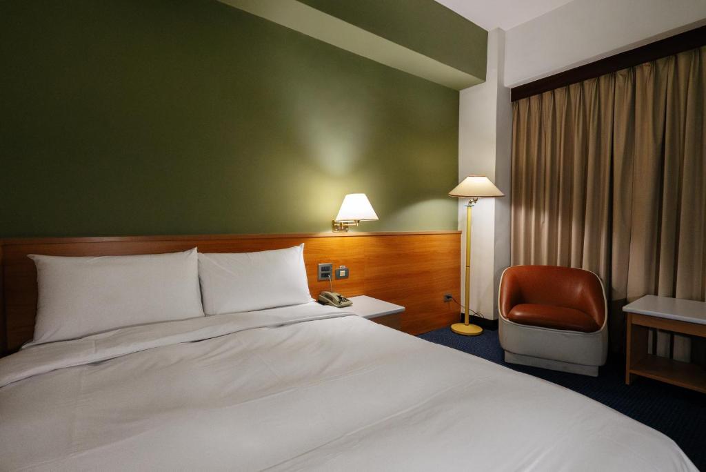 Postel nebo postele na pokoji v ubytování 天津大酒店 Vagus Hotel