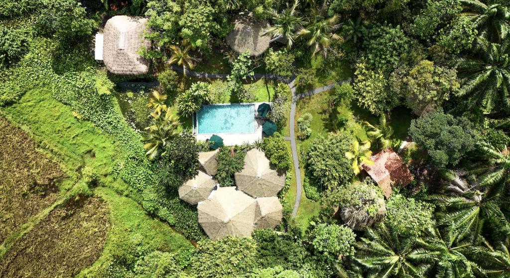 an aerial view of a house with a swimming pool at Huma Terra Lodges in Hikkaduwa