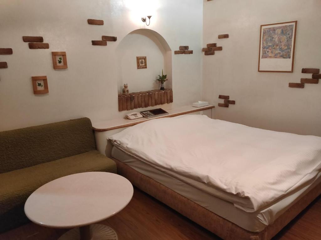 Postel nebo postele na pokoji v ubytování アネックス艶 -大人専用-