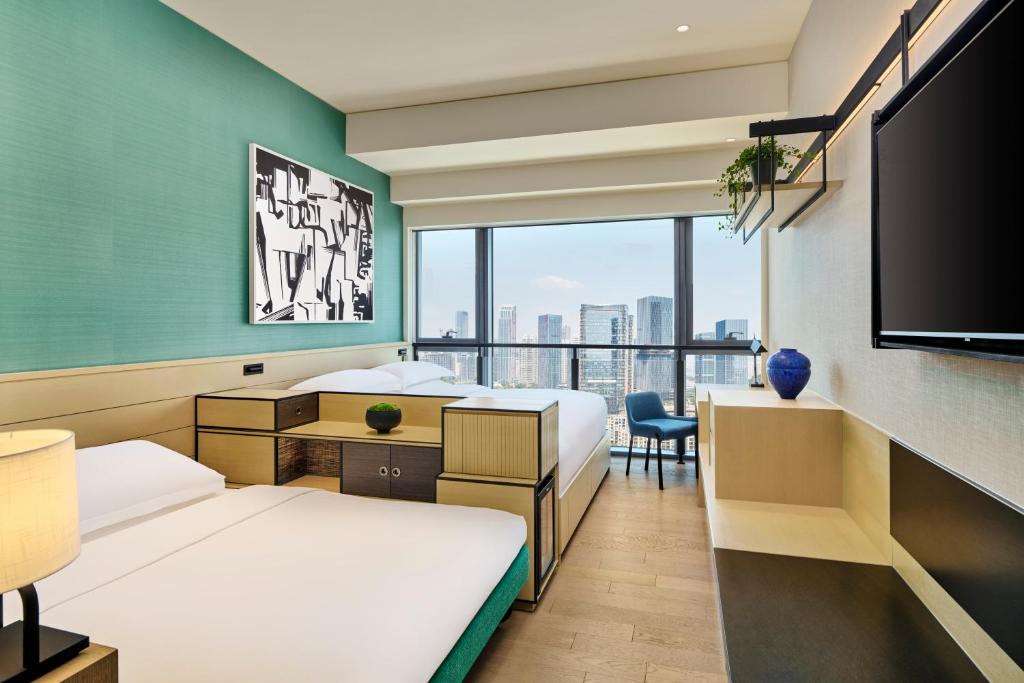Postel nebo postele na pokoji v ubytování Artyzen Habitat Hengqin Zhuhai