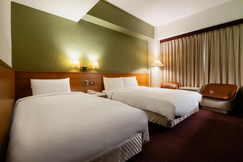 Postel nebo postele na pokoji v ubytování 天津大酒店 Vagus Hotel