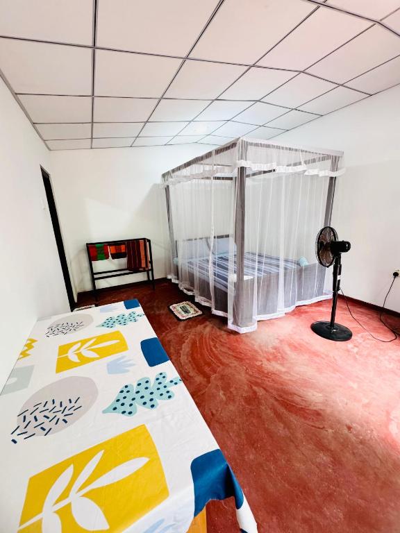 Postel nebo postele na pokoji v ubytování Sea Hub Resort Midigama