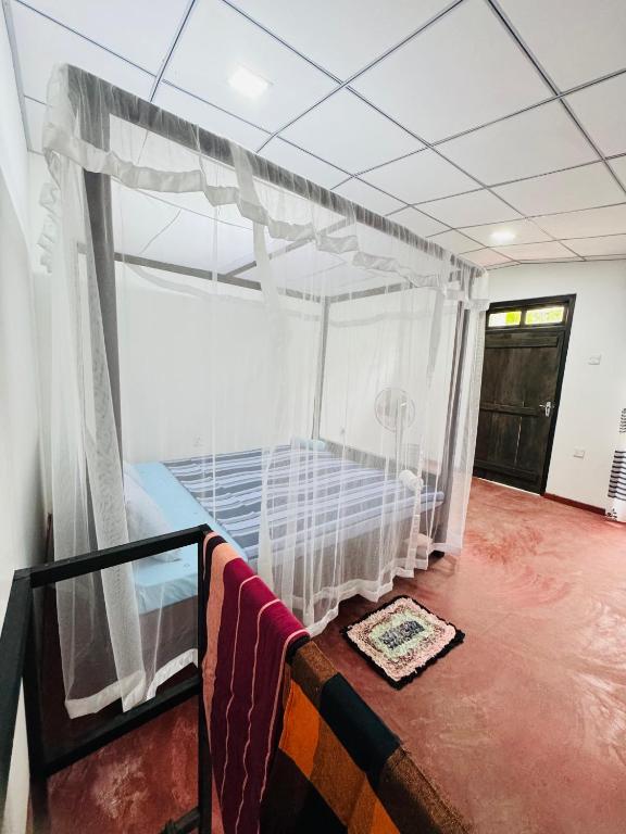 Postel nebo postele na pokoji v ubytování Sea Hub Resort Midigama