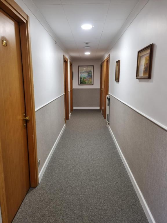 an empty hallway in a office building with at Hotel Calypso in Ventimiglia