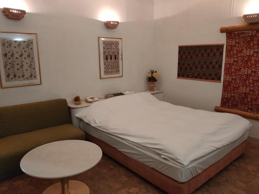 Postel nebo postele na pokoji v ubytování アネックス艶 -大人専用-