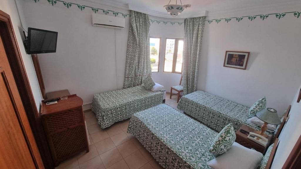 Postel nebo postele na pokoji v ubytování Hotel Zelis