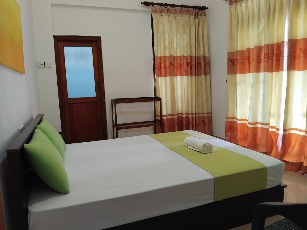 Postel nebo postele na pokoji v ubytování Paradise Residence Hanthana