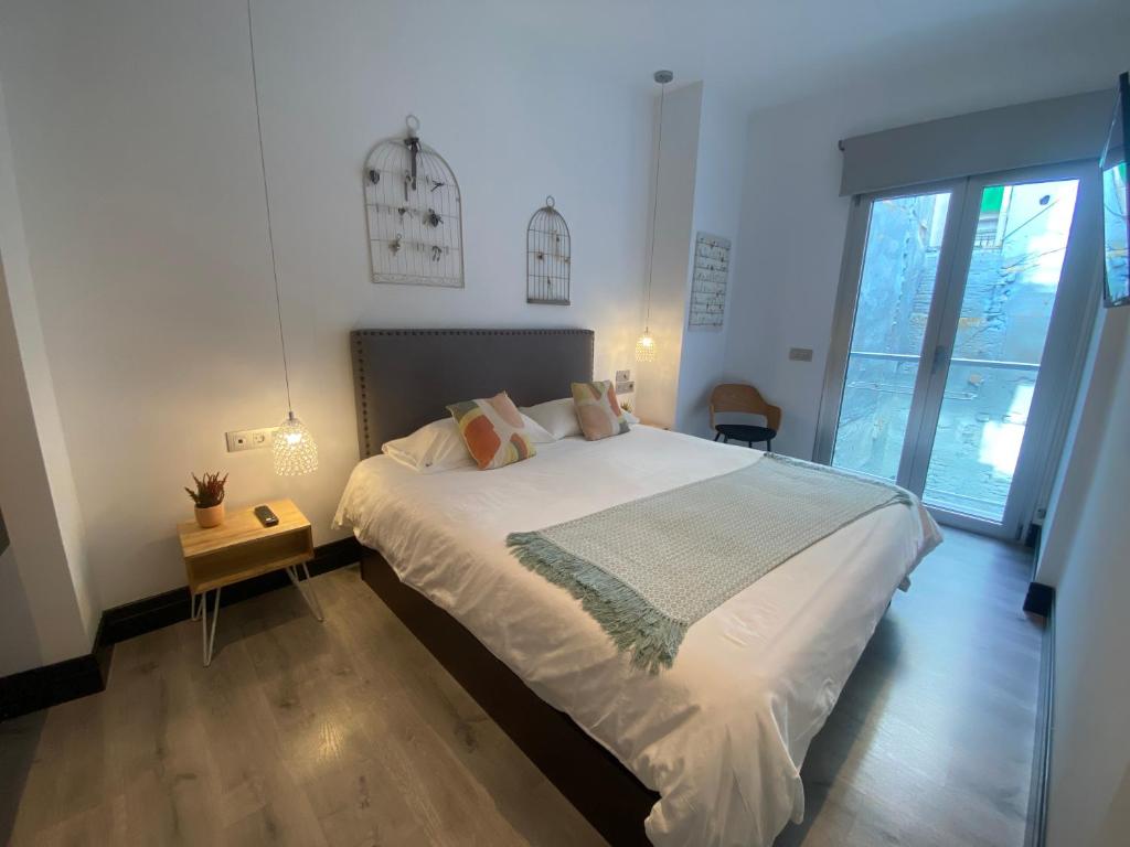 Posteľ alebo postele v izbe v ubytovaní Stay U-nique Apartments Rosaleda