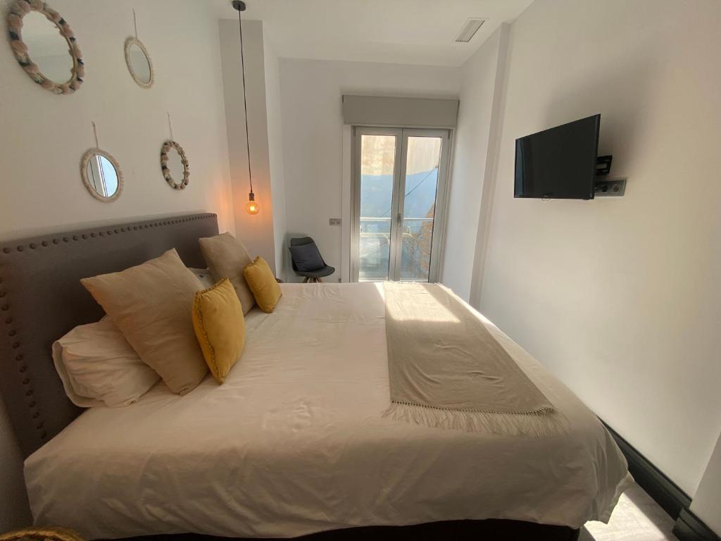 Posteľ alebo postele v izbe v ubytovaní Stay U-nique Apartments Rosaleda