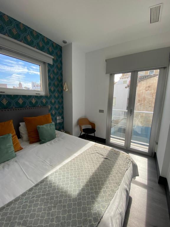 Posteľ alebo postele v izbe v ubytovaní Stay U-nique Apartments Rosaleda