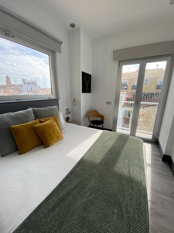 Posteľ alebo postele v izbe v ubytovaní Stay U-nique Apartments Rosaleda