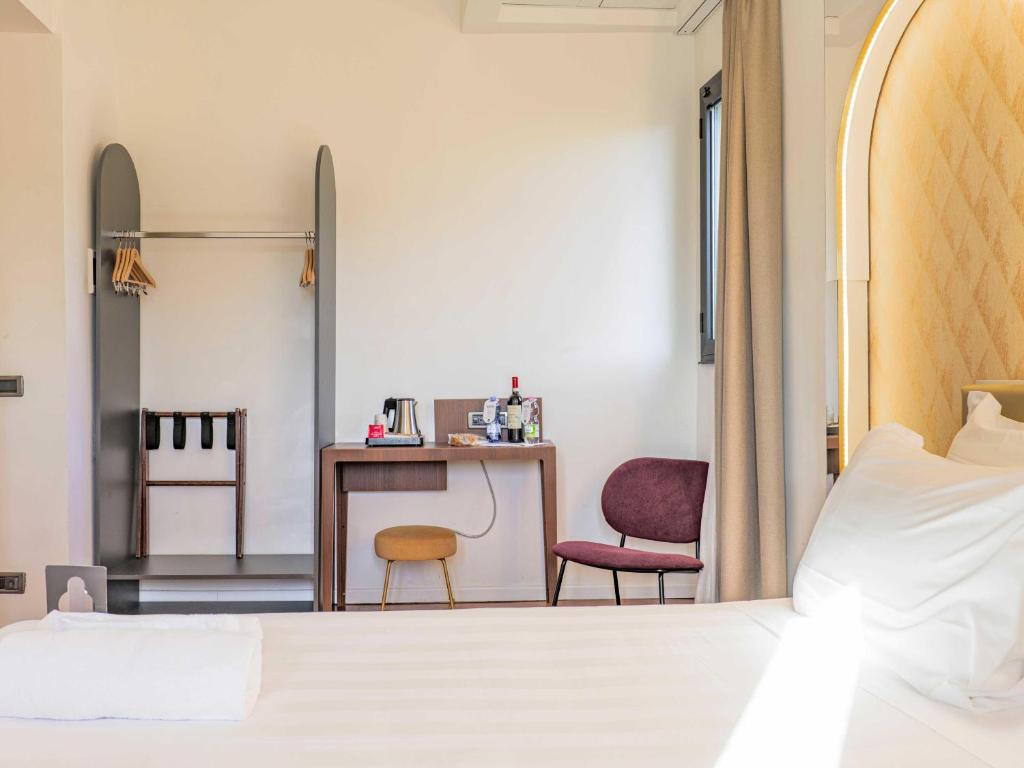 Postel nebo postele na pokoji v ubytování B&B Hotel Firenze Laurus Al Duomo