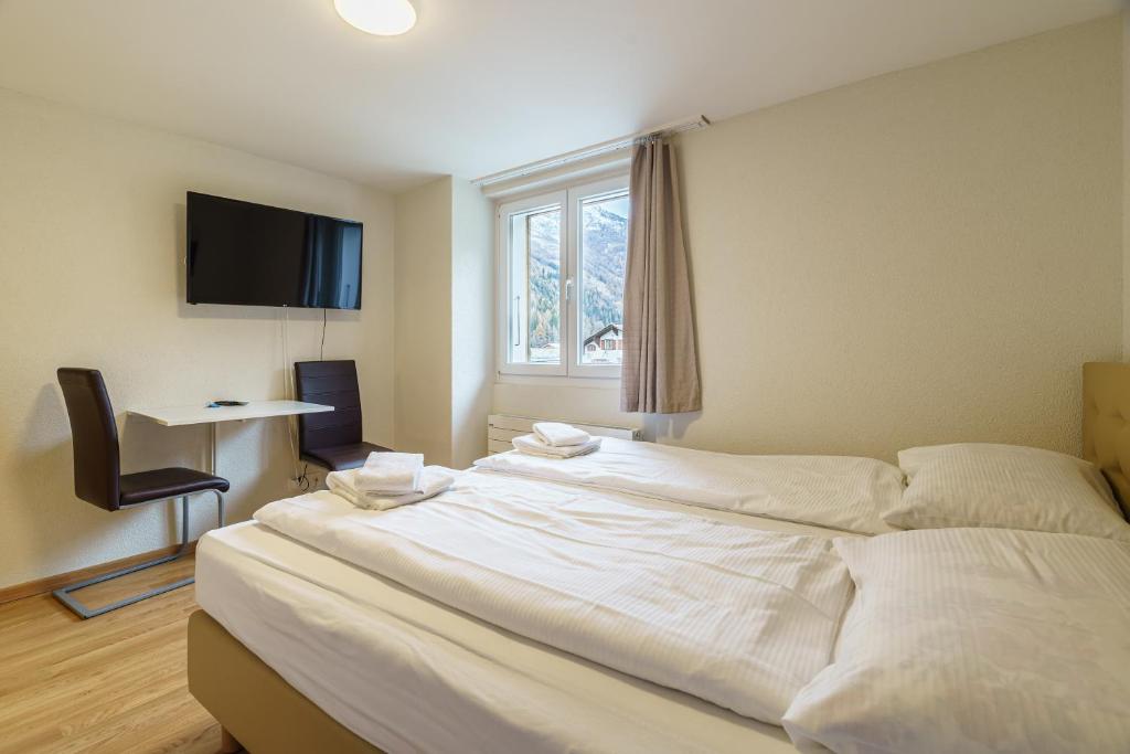 Postel nebo postele na pokoji v ubytování Haus Astoria
