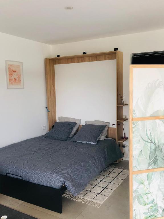 Postel nebo postele na pokoji v ubytování Studio Mimosa