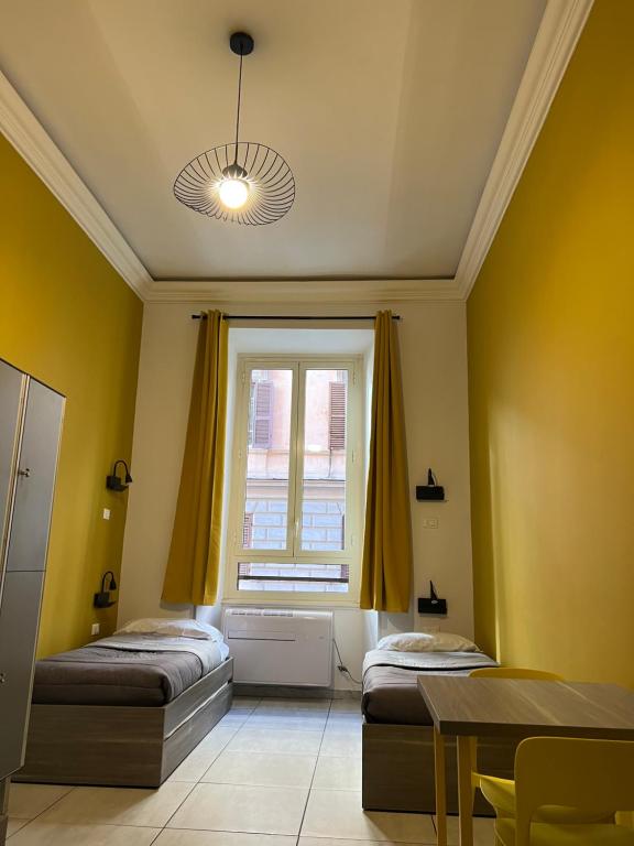 Postel nebo postele na pokoji v ubytování Palladini Rome