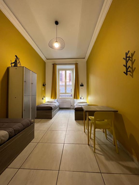 Postel nebo postele na pokoji v ubytování Palladini Rome