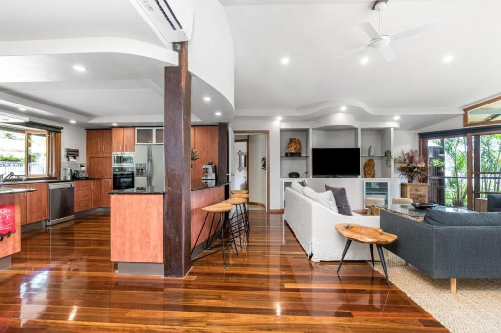 a living room with a couch and a table at Cape Byron Suite 5 Private Suite with Ensuite in Byron Bay