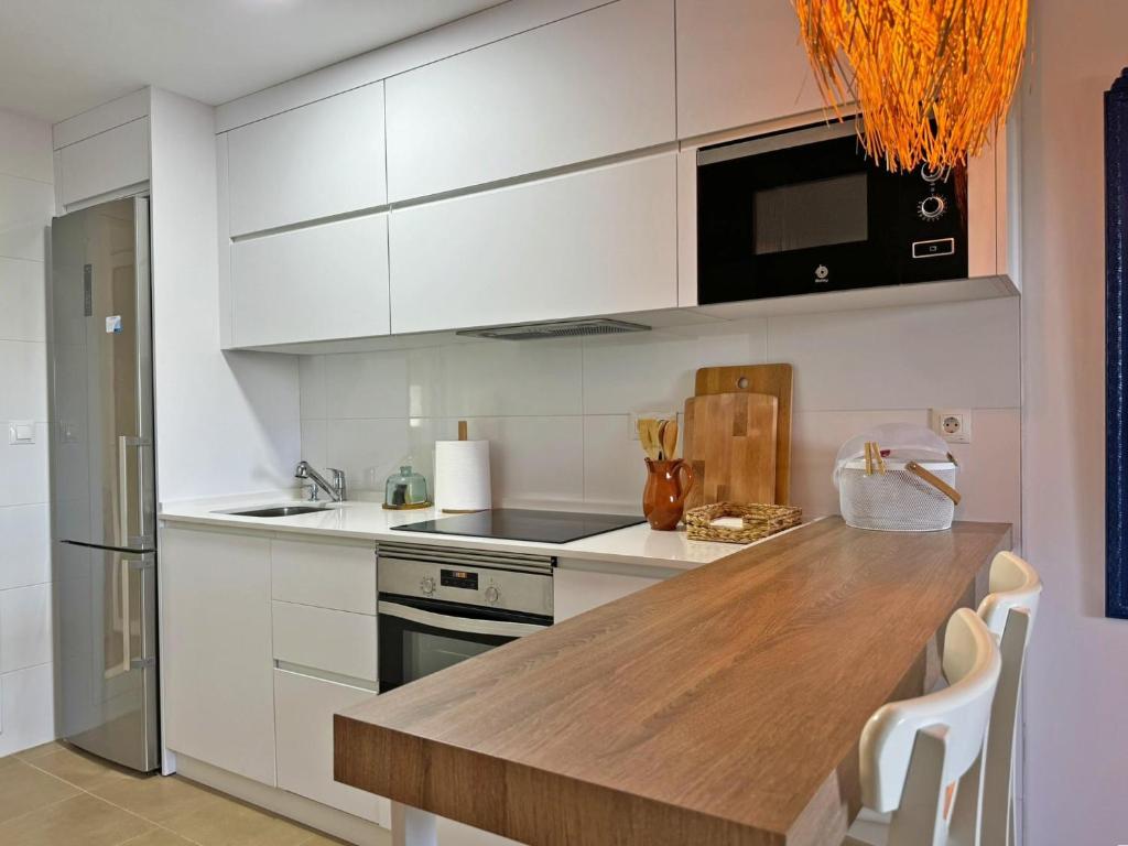 Kuchyňa alebo kuchynka v ubytovaní Apartamento Dunas Candor - Ole Solutions