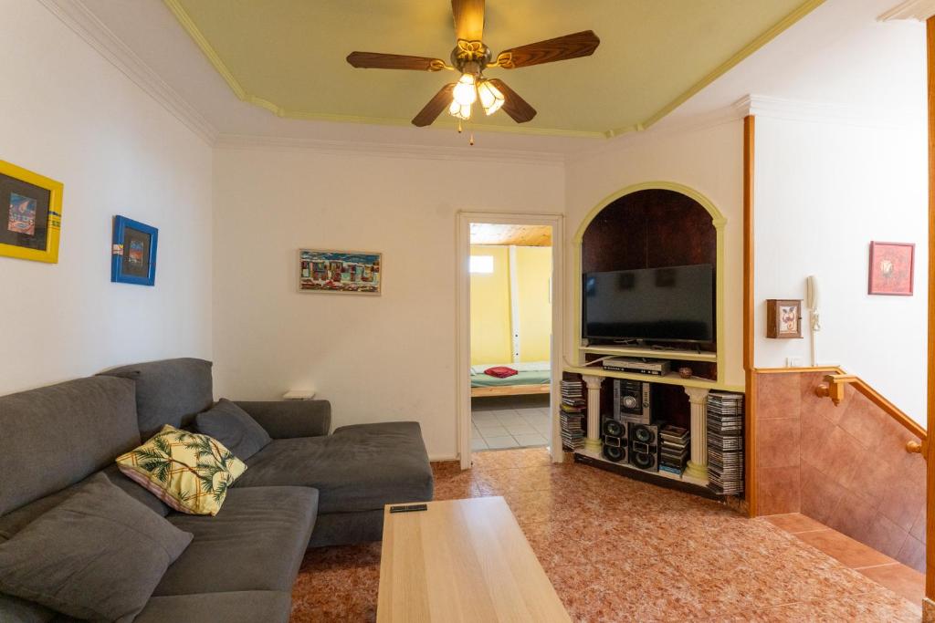 Televízia a/alebo spoločenská miestnosť v ubytovaní Casa Resi