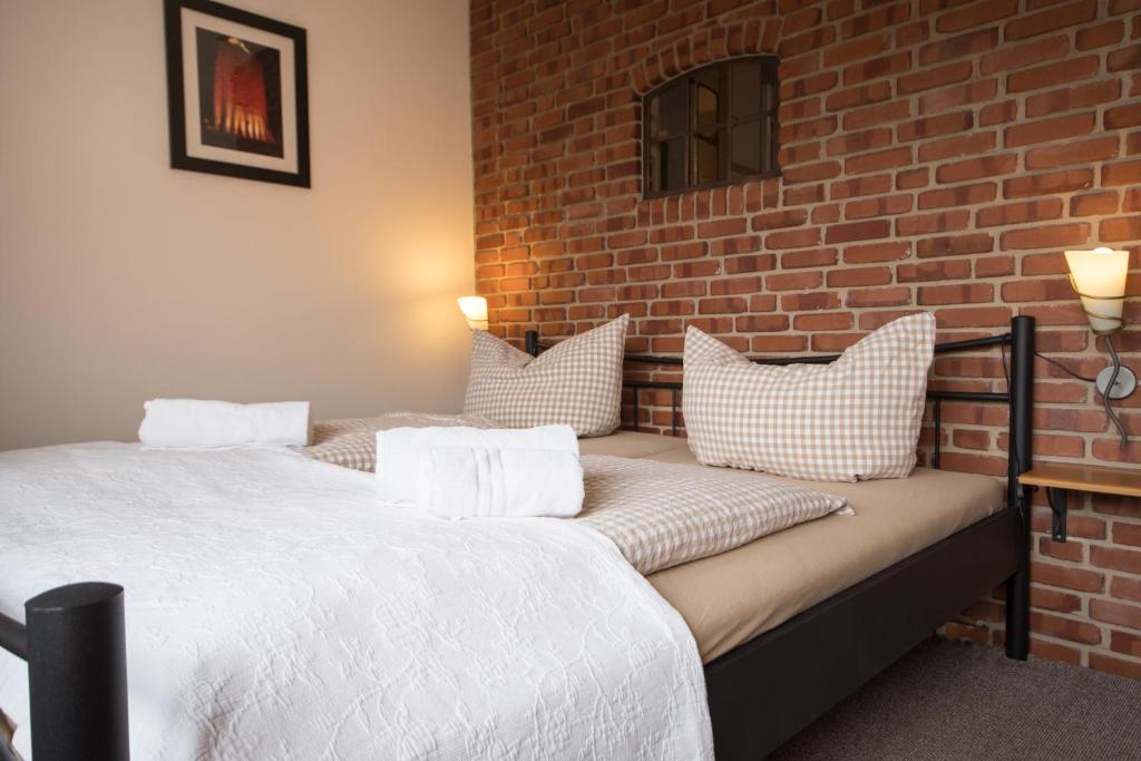 Postel nebo postele na pokoji v ubytování Hotel Nige Hus