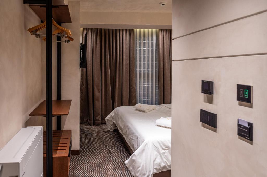 Postel nebo postele na pokoji v ubytování Mattis Hotel