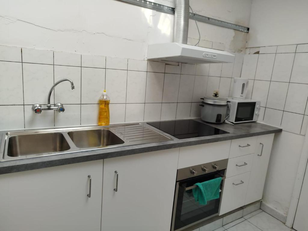 Kuchyň nebo kuchyňský kout v ubytování 2 Chambre disponible