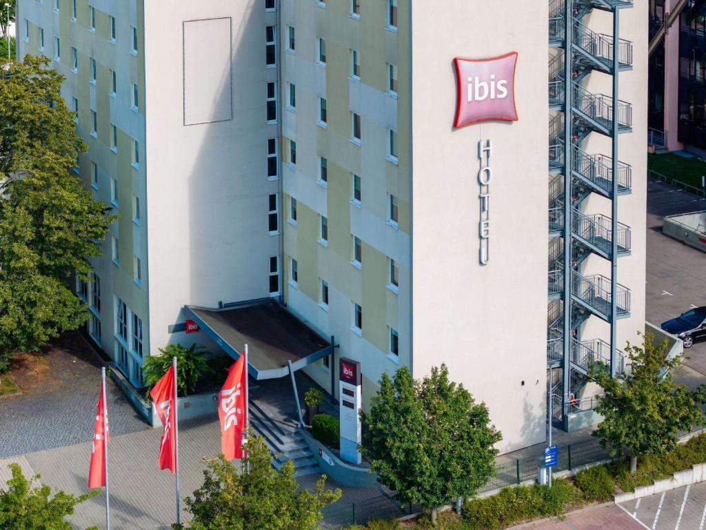 a building with aubs sign on the side of it at ibis Stuttgart Airport Messe in Leinfelden-Echterdingen