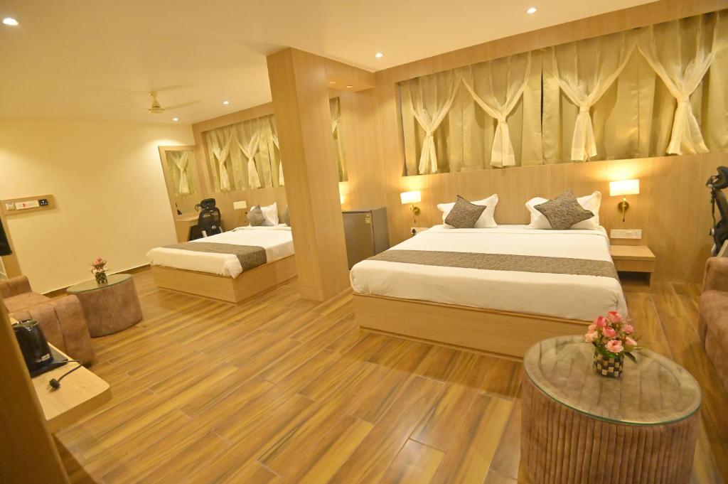 Postel nebo postele na pokoji v ubytování Hotel JK palace