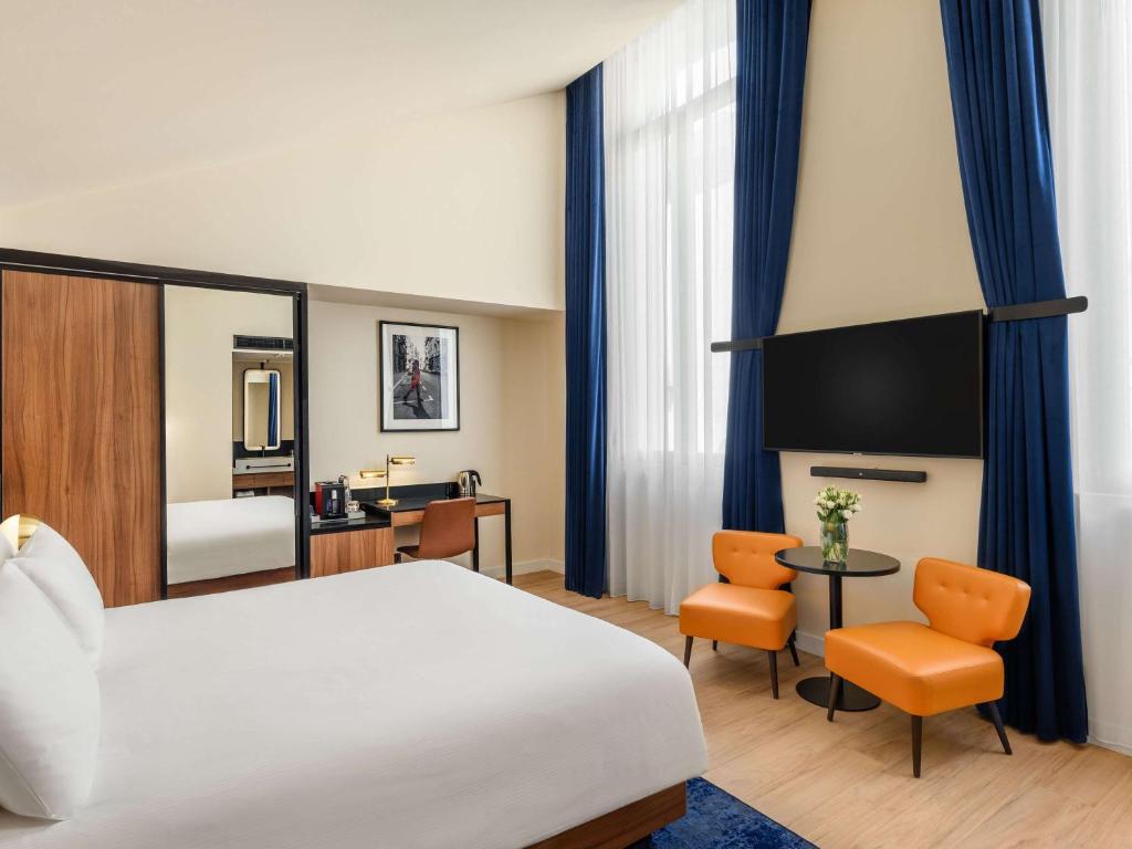 Posteľ alebo postele v izbe v ubytovaní Pullman Budapest
