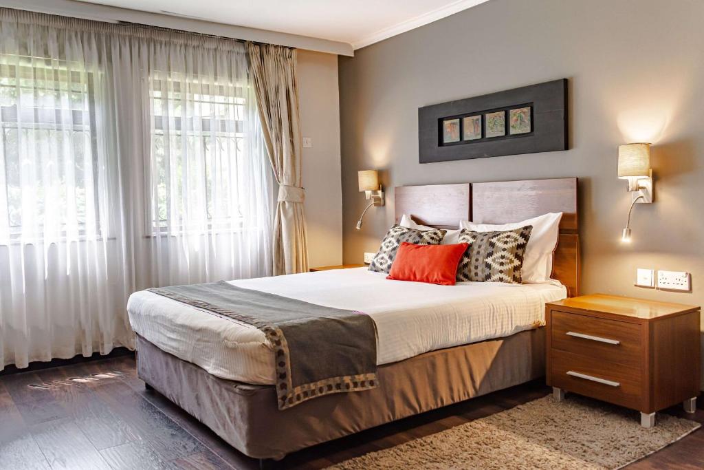 Uma cama ou camas num quarto em Heri Heights Hotel Apartments, SureStay Collection by Best Western