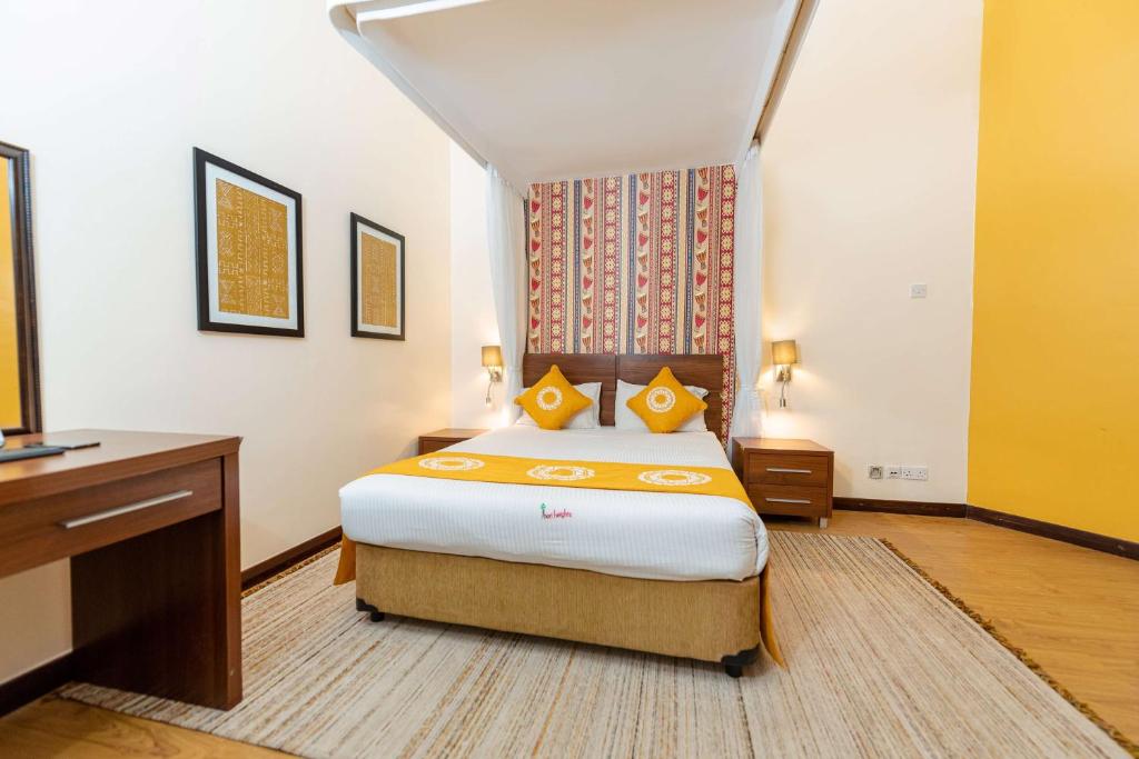 Uma cama ou camas num quarto em Heri Heights Hotel Apartments, SureStay Collection by Best Western