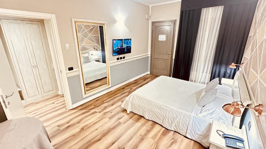 Postel nebo postele na pokoji v ubytování Hotel Malpensa INN Aereoporto