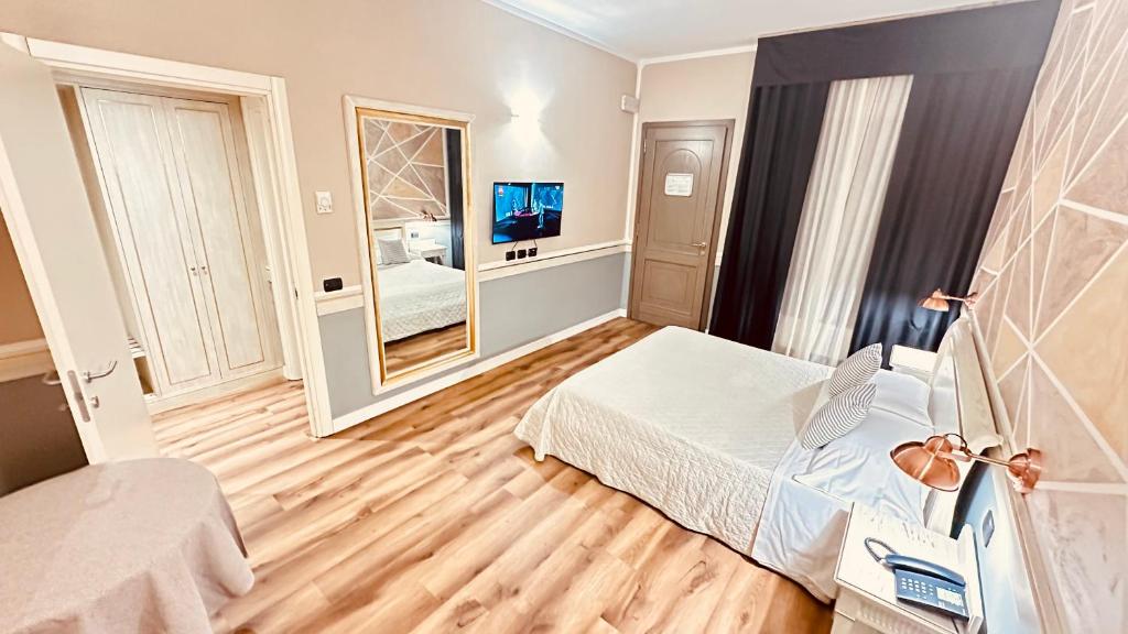 Postel nebo postele na pokoji v ubytování Hotel Malpensa INN Aereoporto