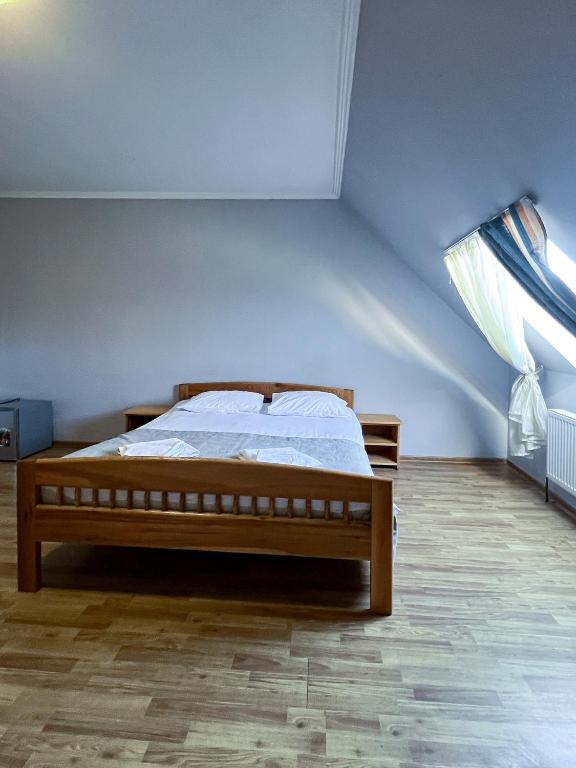 Postel nebo postele na pokoji v ubytování Хостел-готель Кремзлик
