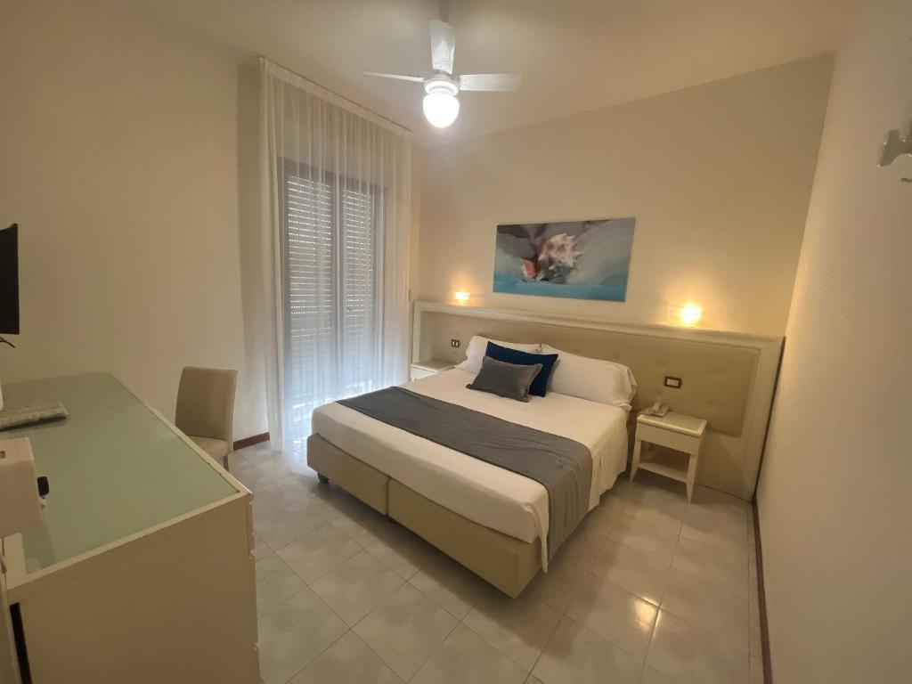 Postel nebo postele na pokoji v ubytování Hotel Athena