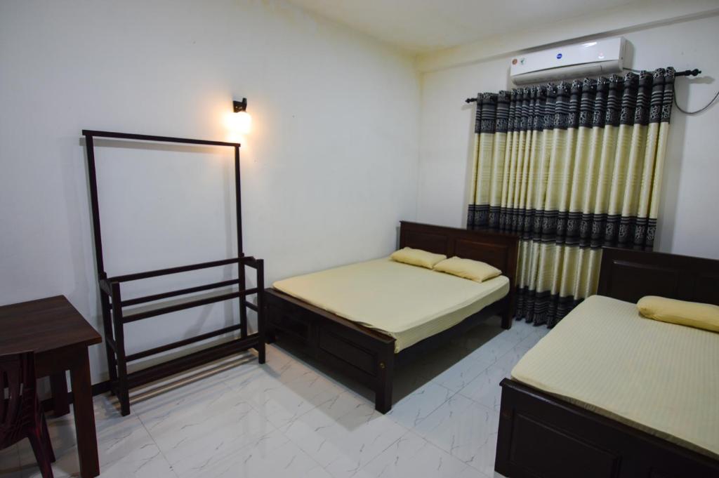 Postel nebo postele na pokoji v ubytování Hotel Sanhida Polonnaruwa