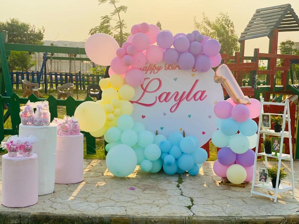 a balloon arch with a sign that reads jaya at Ramage Hotel & Resort in Cairo