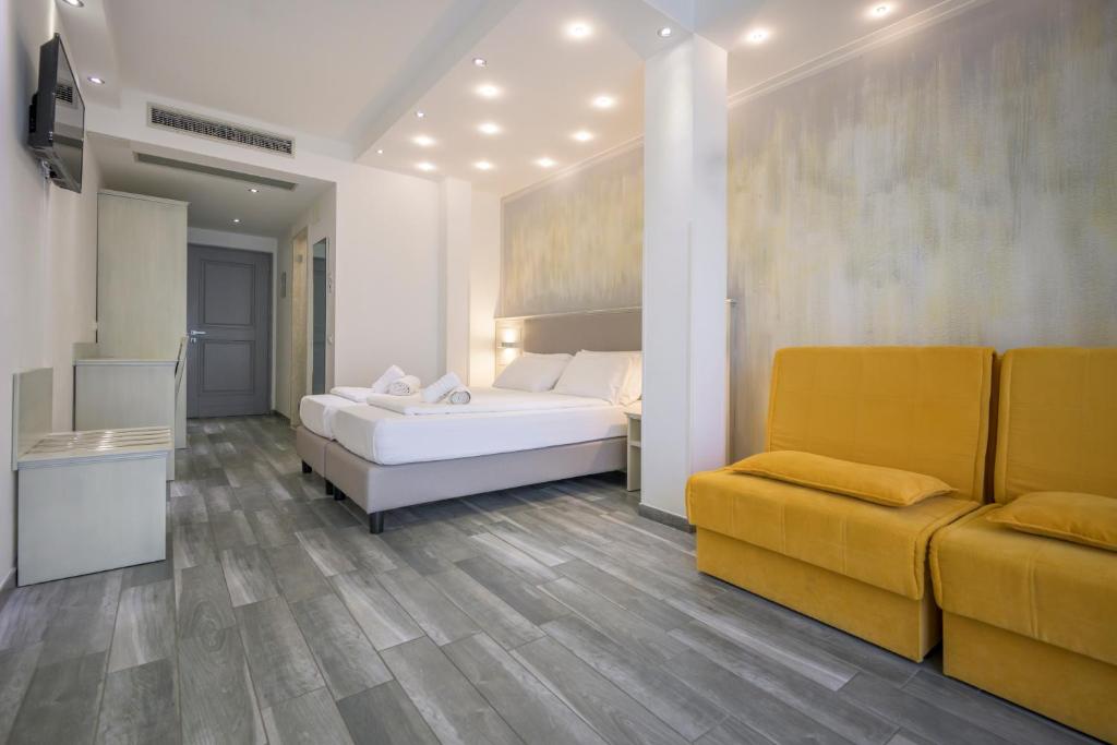 Posteľ alebo postele v izbe v ubytovaní Hotel Villa Paradiso Suite