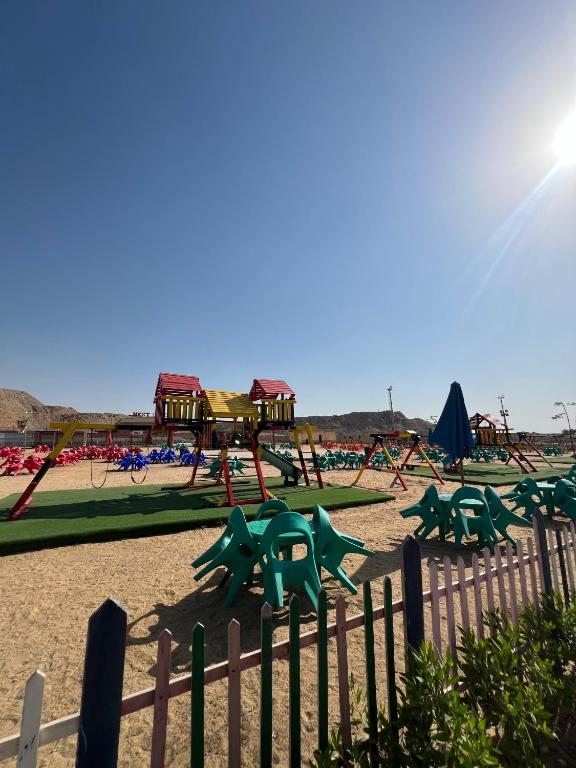 a park with a playground with slides and swings at Ramage Hotel & Resort in Cairo