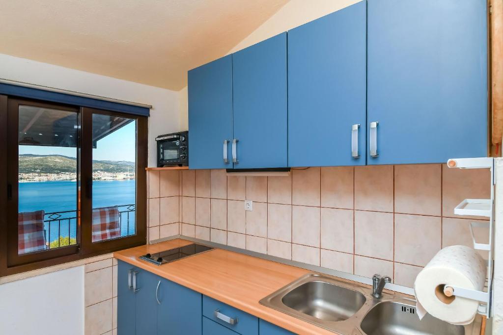 Kuchyň nebo kuchyňský kout v ubytování Apartment Denis
