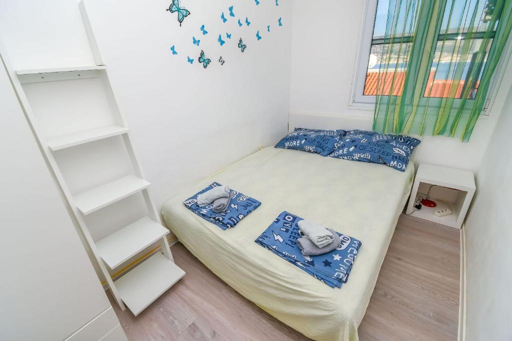 Postel nebo postele na pokoji v ubytování Apartment Denis