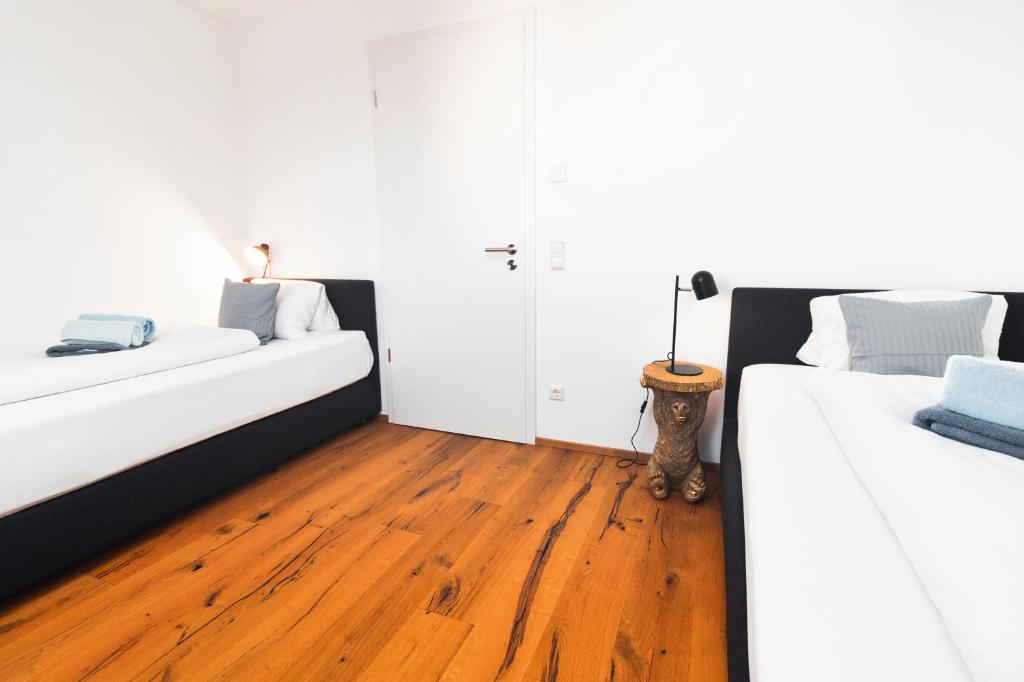 Postel nebo postele na pokoji v ubytování HEIMATEL - Bodensee Residenz Allgäu