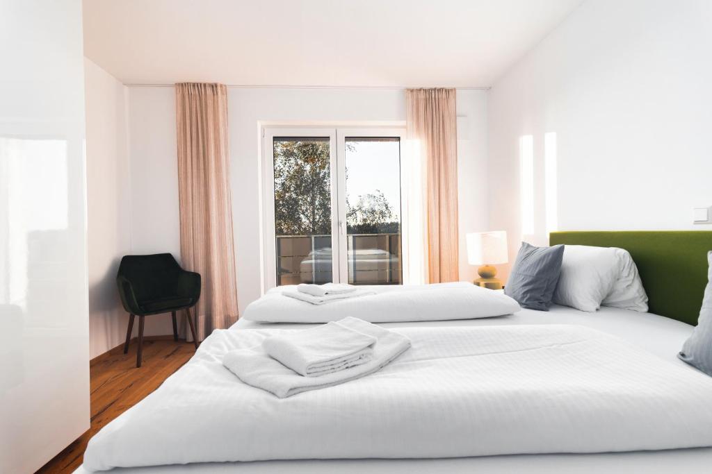 Postel nebo postele na pokoji v ubytování HEIMATEL - Bodensee Residenz Allgäu
