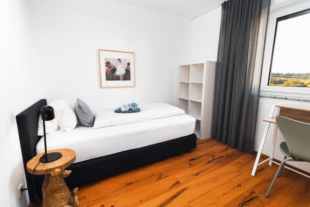 Postel nebo postele na pokoji v ubytování HEIMATEL - Bodensee Residenz Allgäu