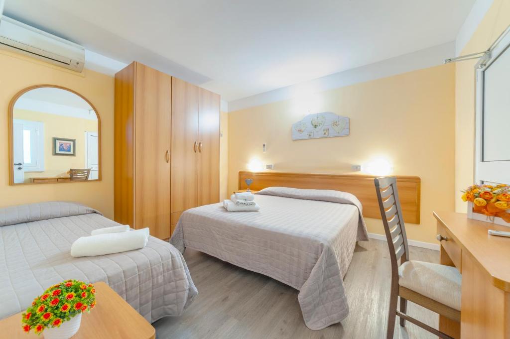 Posteľ alebo postele v izbe v ubytovaní Hotel Nuovo Belvedere