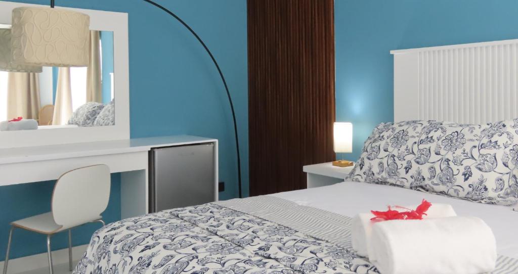 Postel nebo postele na pokoji v ubytování All Seasons Hotel