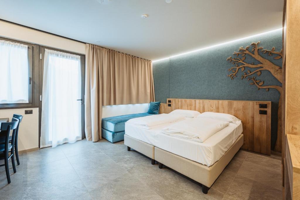 Postel nebo postele na pokoji v ubytování Residence Piz Aot