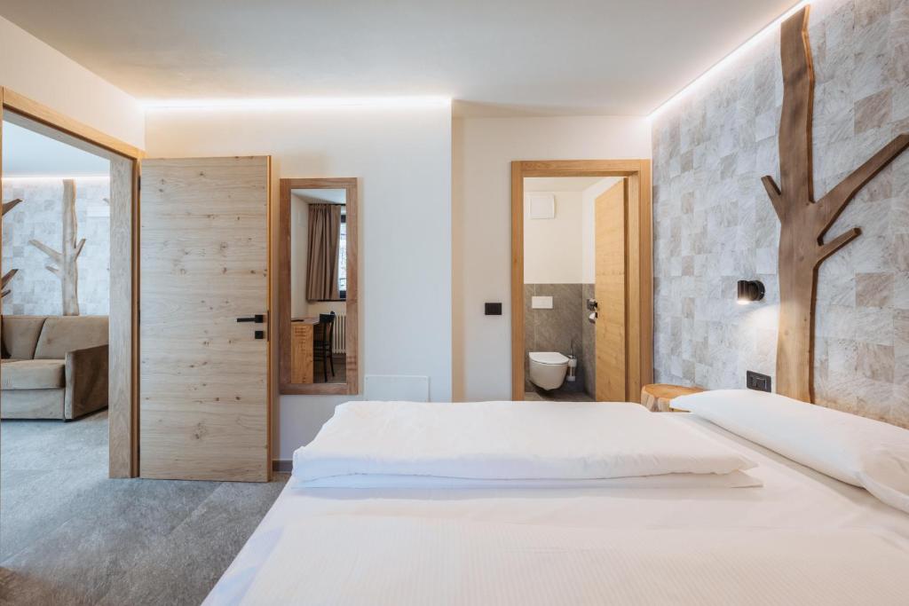 Postel nebo postele na pokoji v ubytování Residence Piz Aot