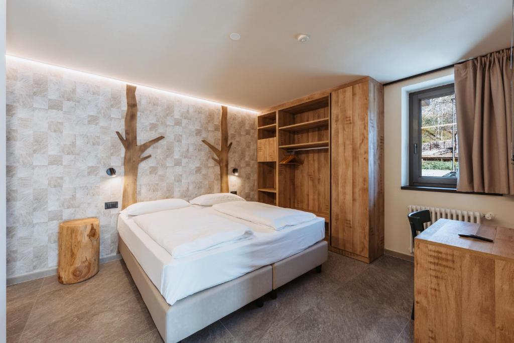 Postel nebo postele na pokoji v ubytování Residence Piz Aot