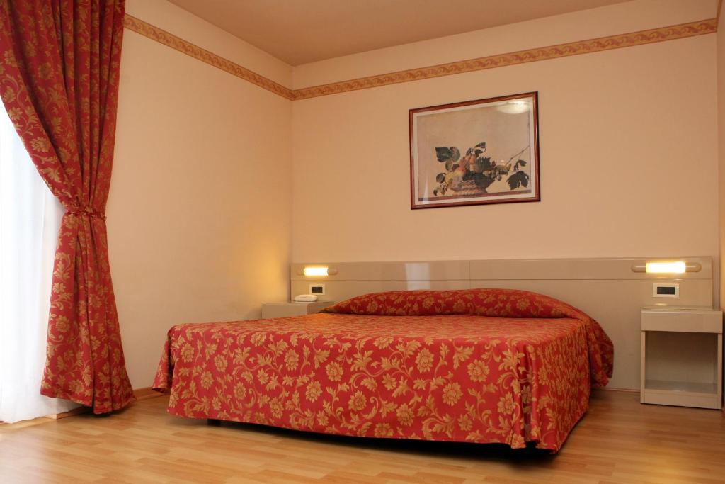 Posteľ alebo postele v izbe v ubytovaní Hotel Excelsior